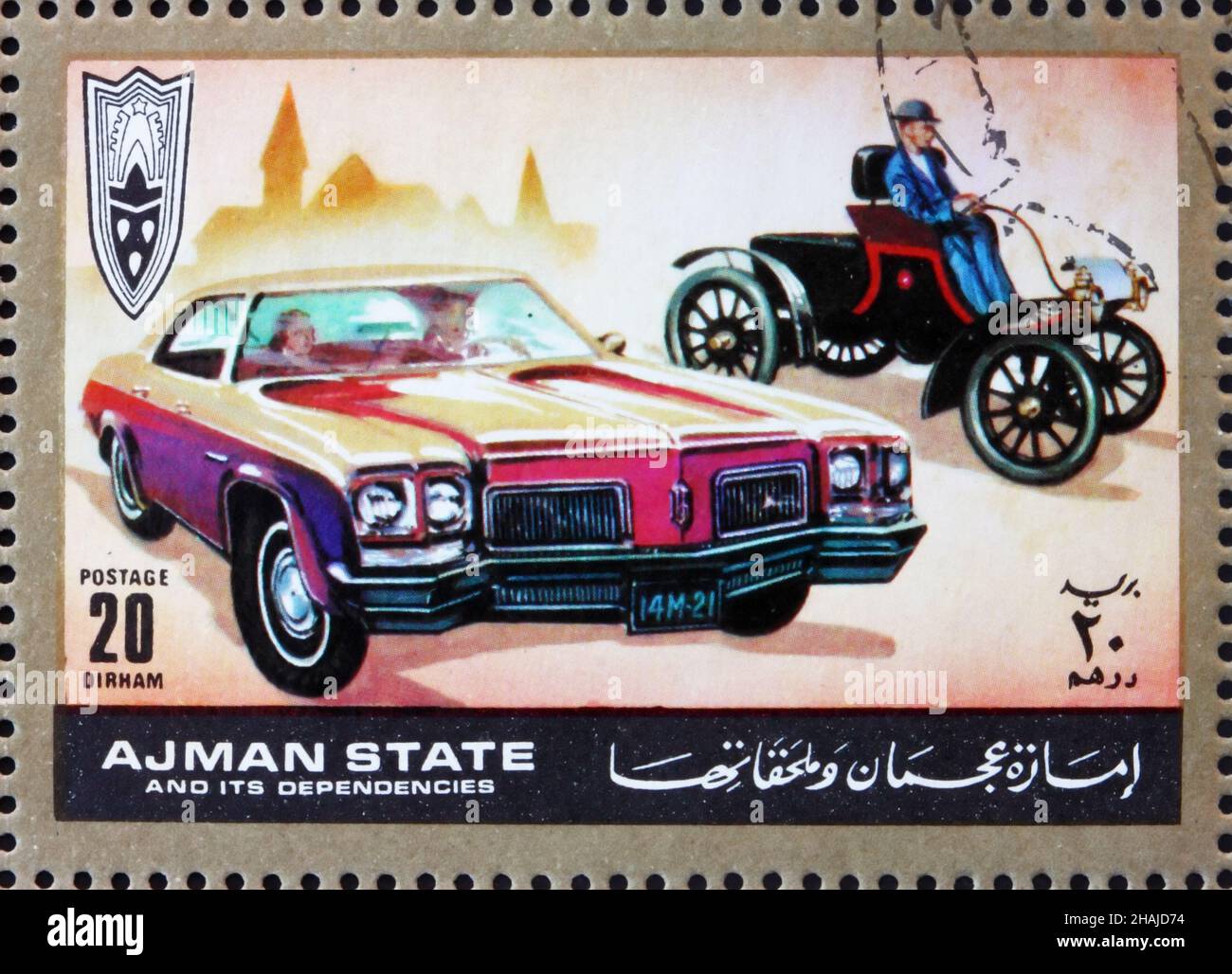AJMAN - CIRCA 1972: a stamp printed in the Ajman shows Ford, Cars Then and Now, circa 1972 Stock Photo