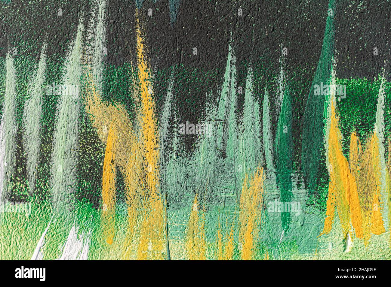 Wall with multi-colored paints as an background. Stock Photo