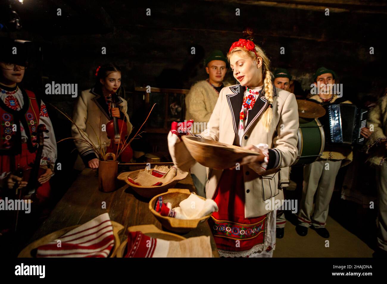 UZHHOROD, UKRAINE - DECEMBER 10, 2021 - People in traditional Ukrainian costumes carry out the rituals during the Andriivski Vechornytsi celebration a Stock Photo