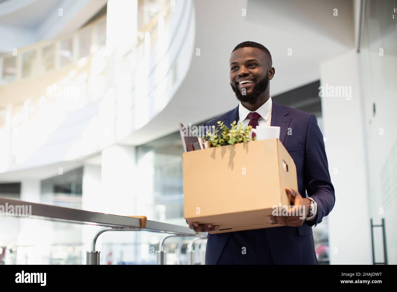 Happy african american young man with working stuff Stock Photo