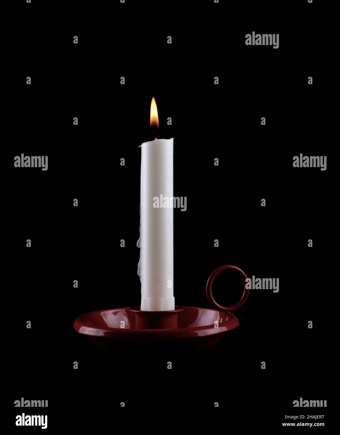 One candle burning brightly on black background Stock Photo
