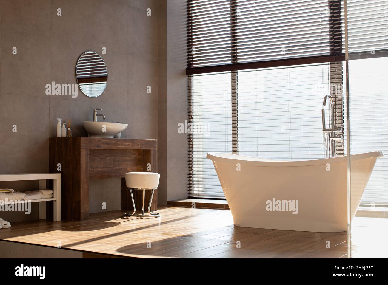 Modern bathroom with panoramic window in luxury apartment Stock Photo