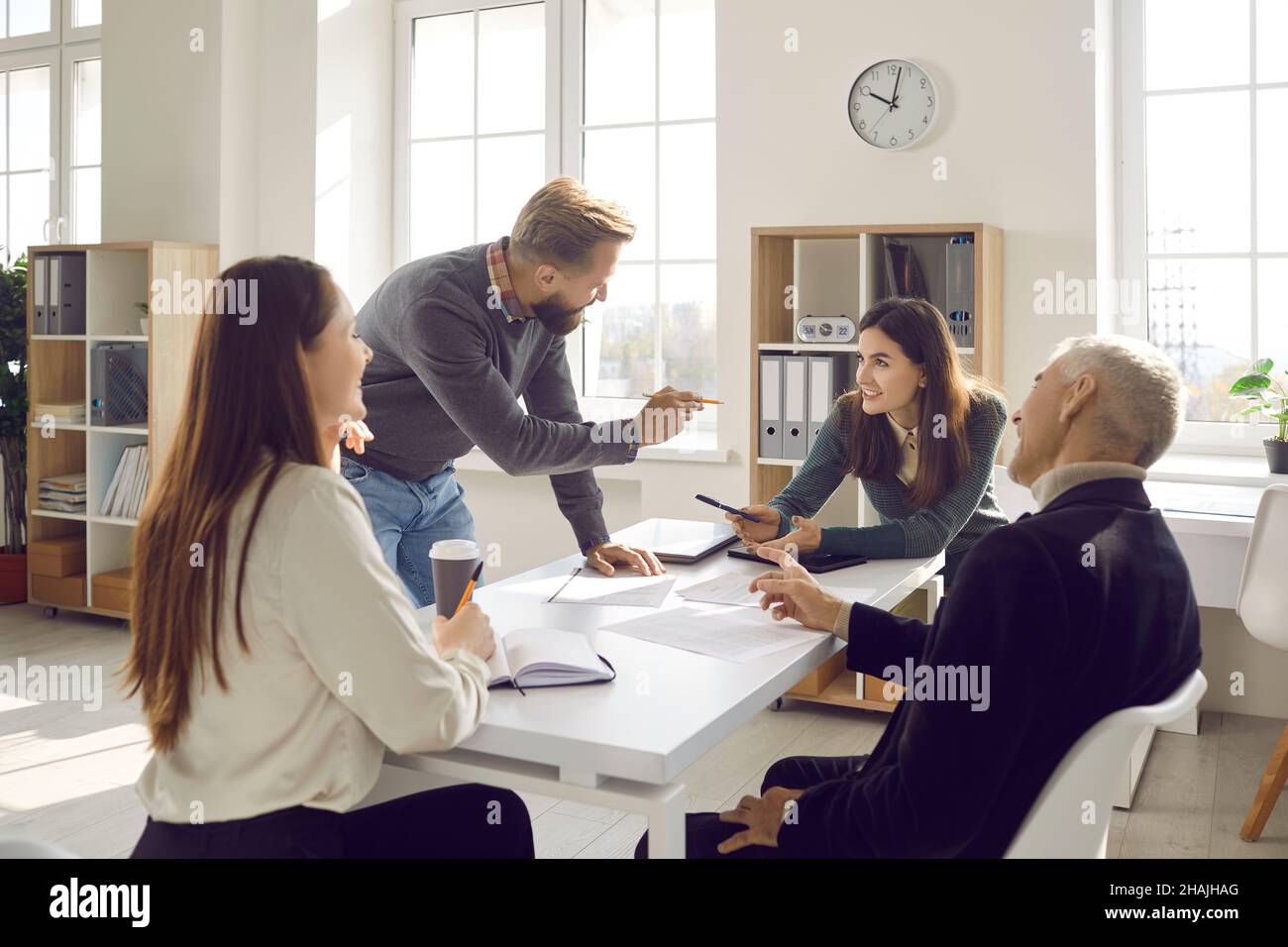 Team of people discussing their business strategy at a work meeting in the office Stock Photo