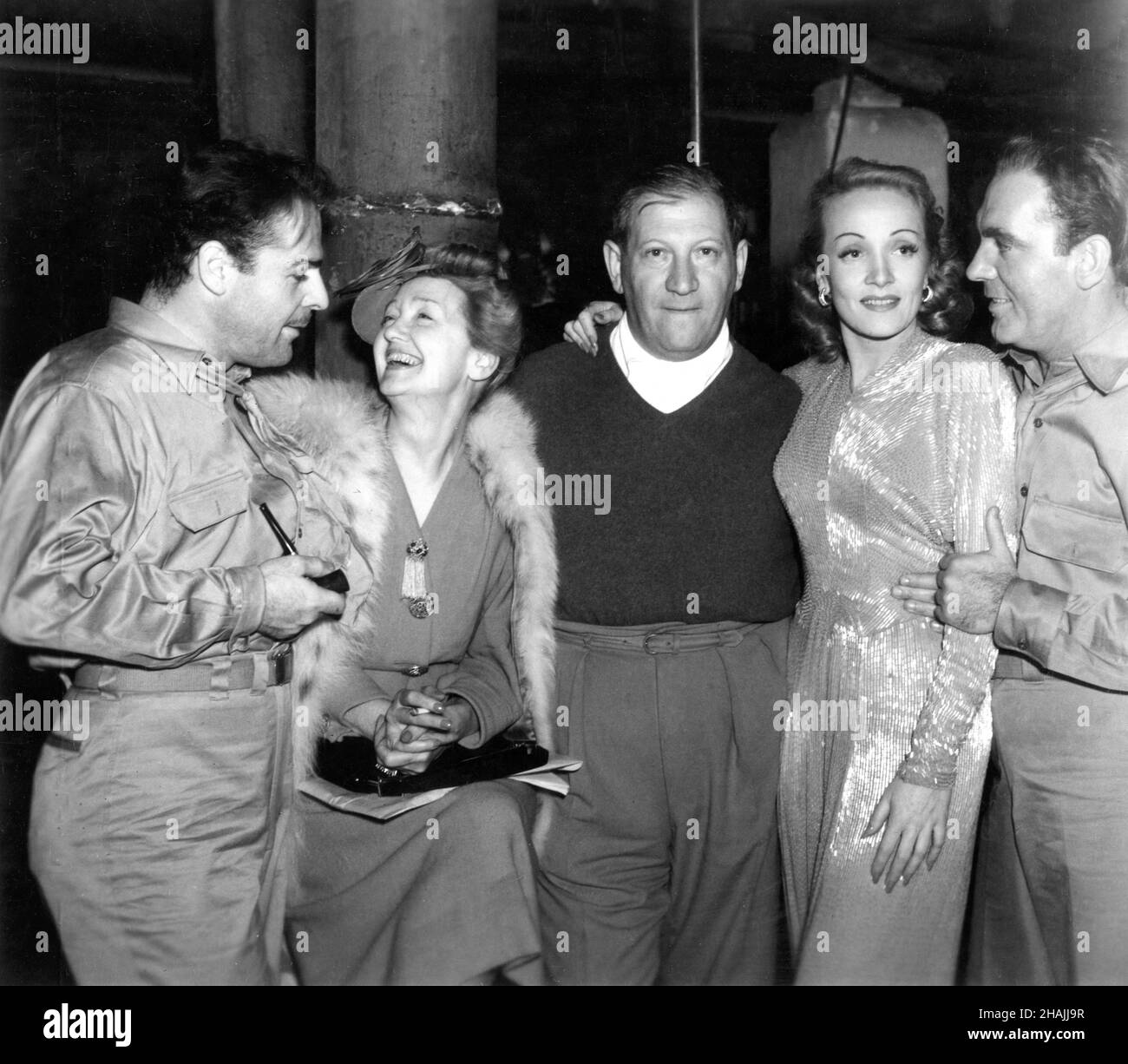 BRIAN DONLEVY Hollywood Gossip Columnist HEDDA HOPPER Director GREGORY RATOFF Set Visitor MARLENE DIETRICH and PAT O'BRIEN on set candid during filming of TWO YANKS IN TRINIDAD 1942 director GREGORY RATOFF Columbia Pictures Stock Photo