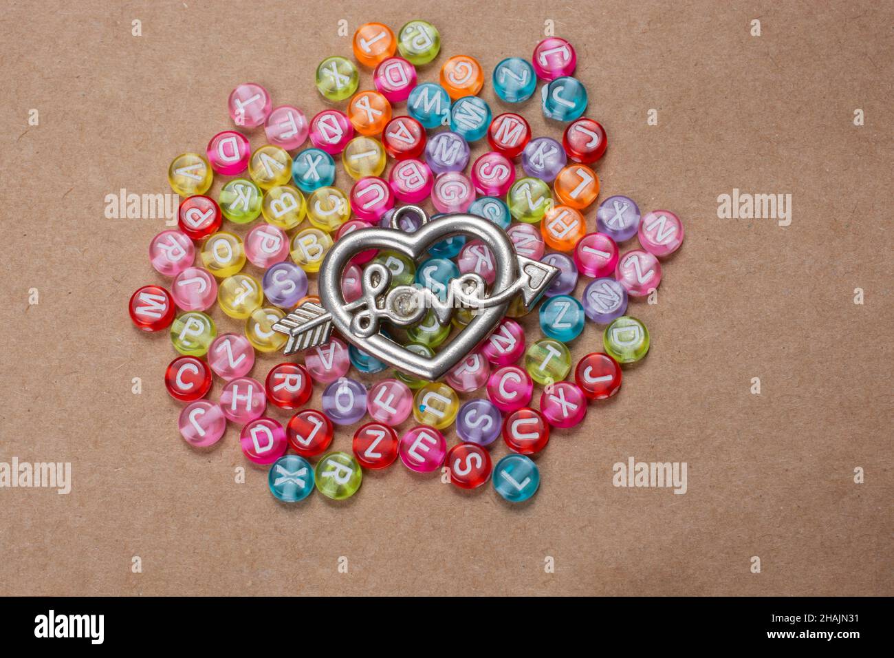 Heart shape and love wording amid colorful alphabet letters Stock Photo ...