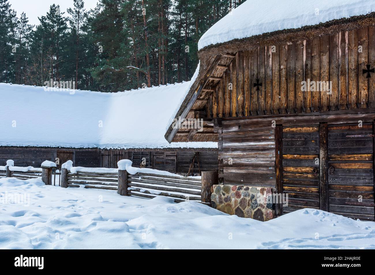 Kurzeme Peasant's horseshoe-shaped cattle yard under snow. Cattle yard’s place of origin is Rucava, Latvia Stock Photo