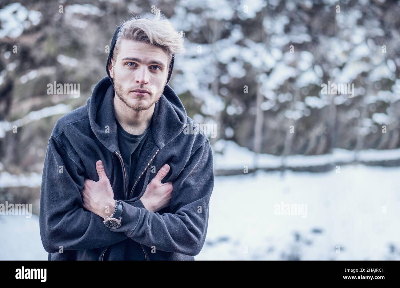 Handsome Young Man Using Smarpthone To Take Photographs Of The Landscape,  While Posing Among Snowy Woods In The Mountain Stock Photo, Picture and  Royalty Free Image. Image 93797057.