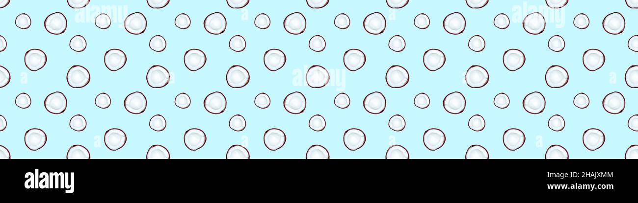 Big banner with seamless pattern of half coconuts isolated on blue background Stock Photo