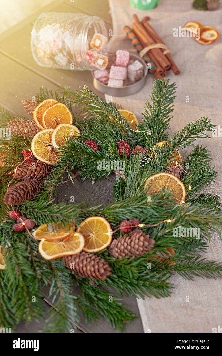 natural spruce wreath on a fabric tablecloth Stock Photo
