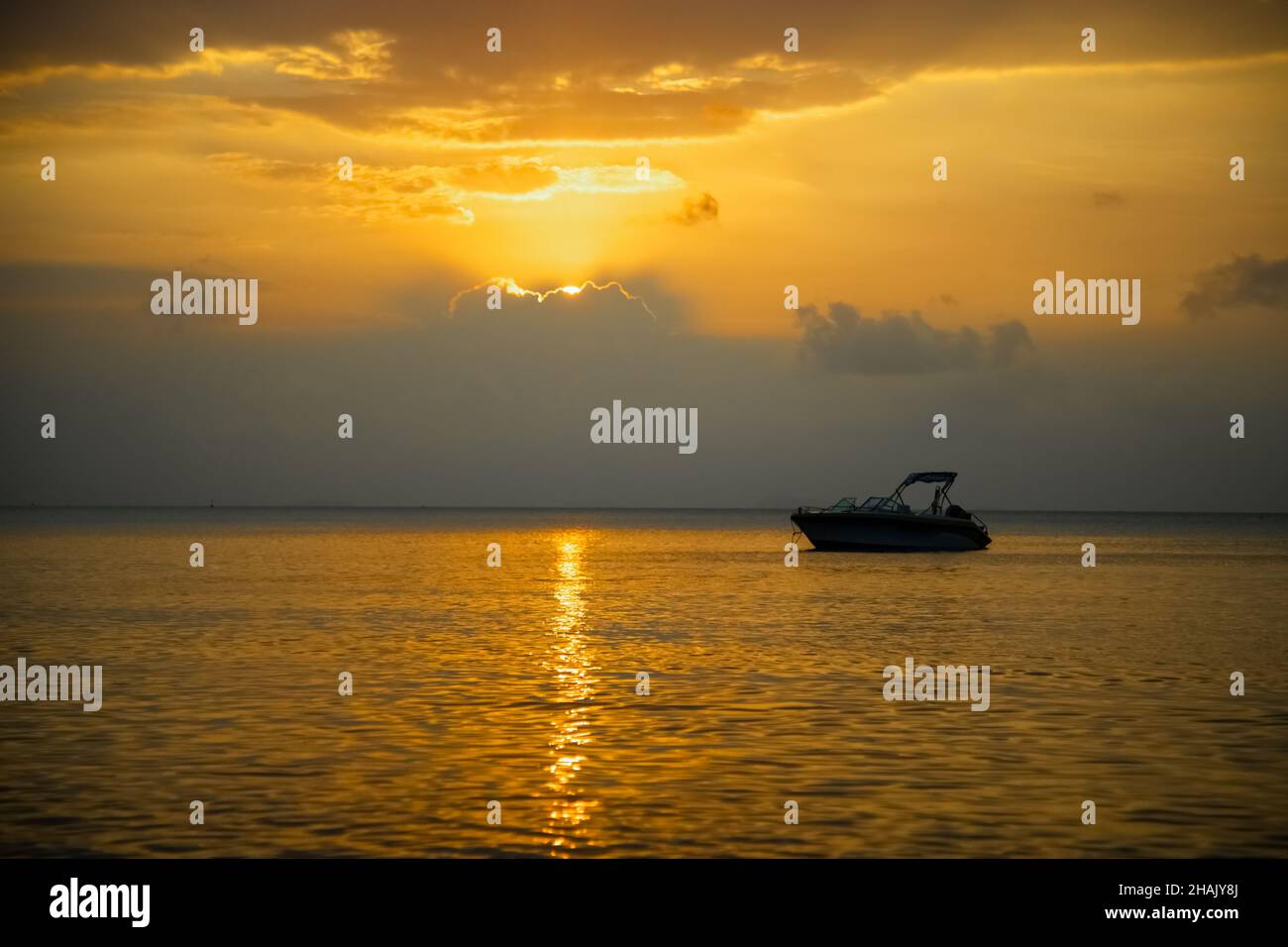 beautiful golden sunset in the sea. sunny path on the water Stock Photo ...