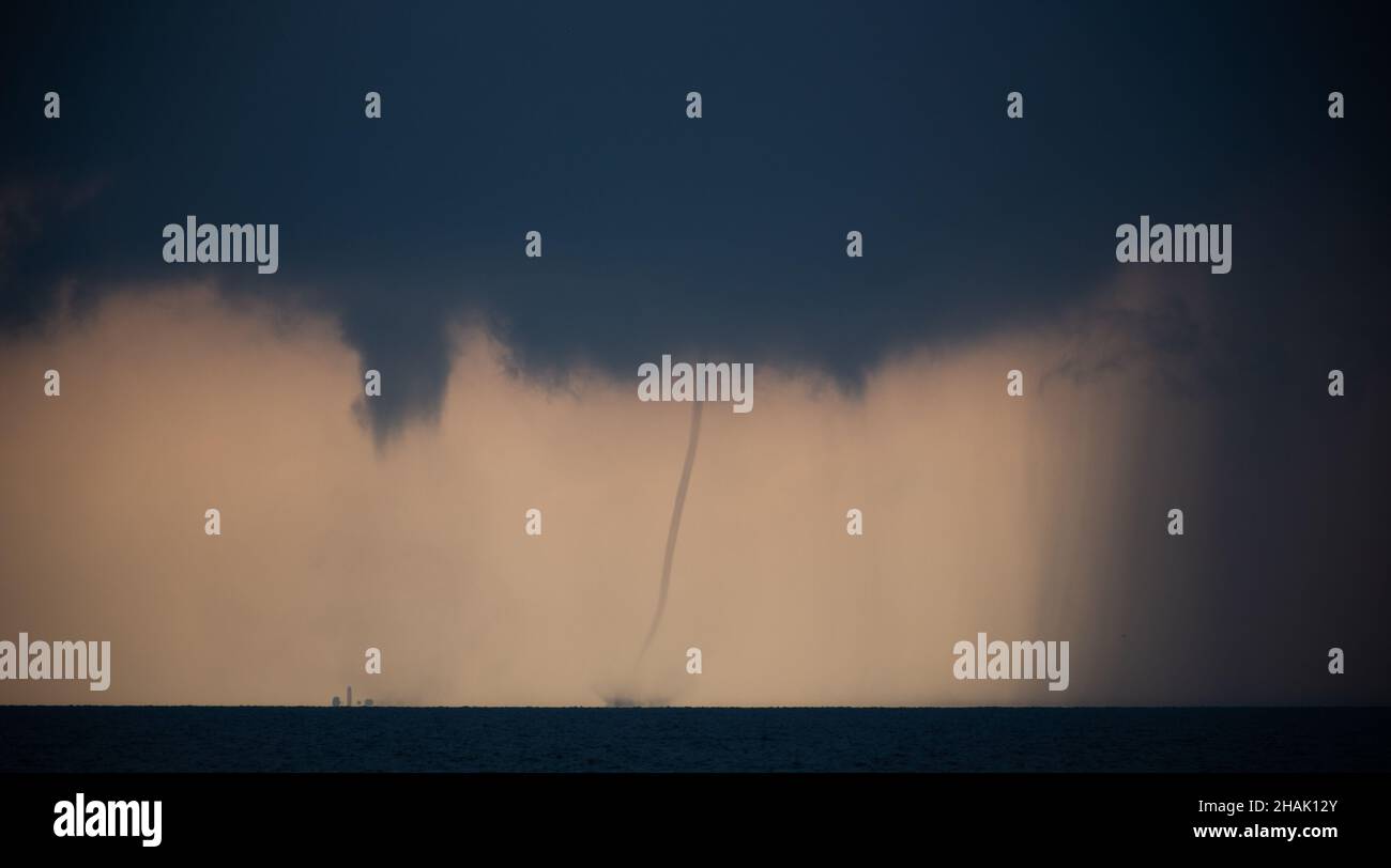 Tornado in the sea during the day against the sky Stock Photo