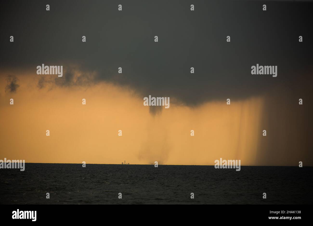 Tornado in the sea during the day against the sky Stock Photo