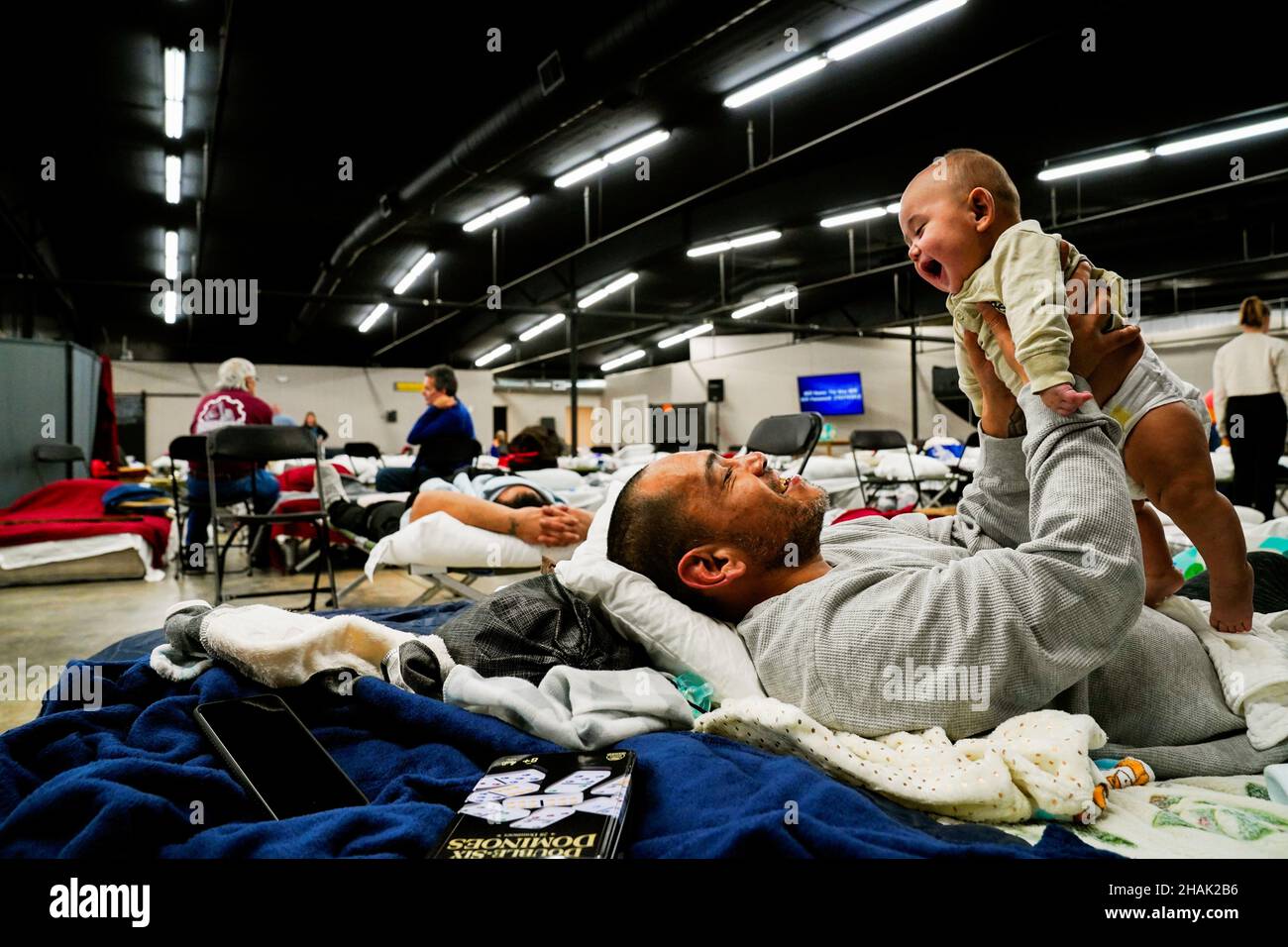 Anthony Vasquez, 42, plays with his four monthold son Michael inside a