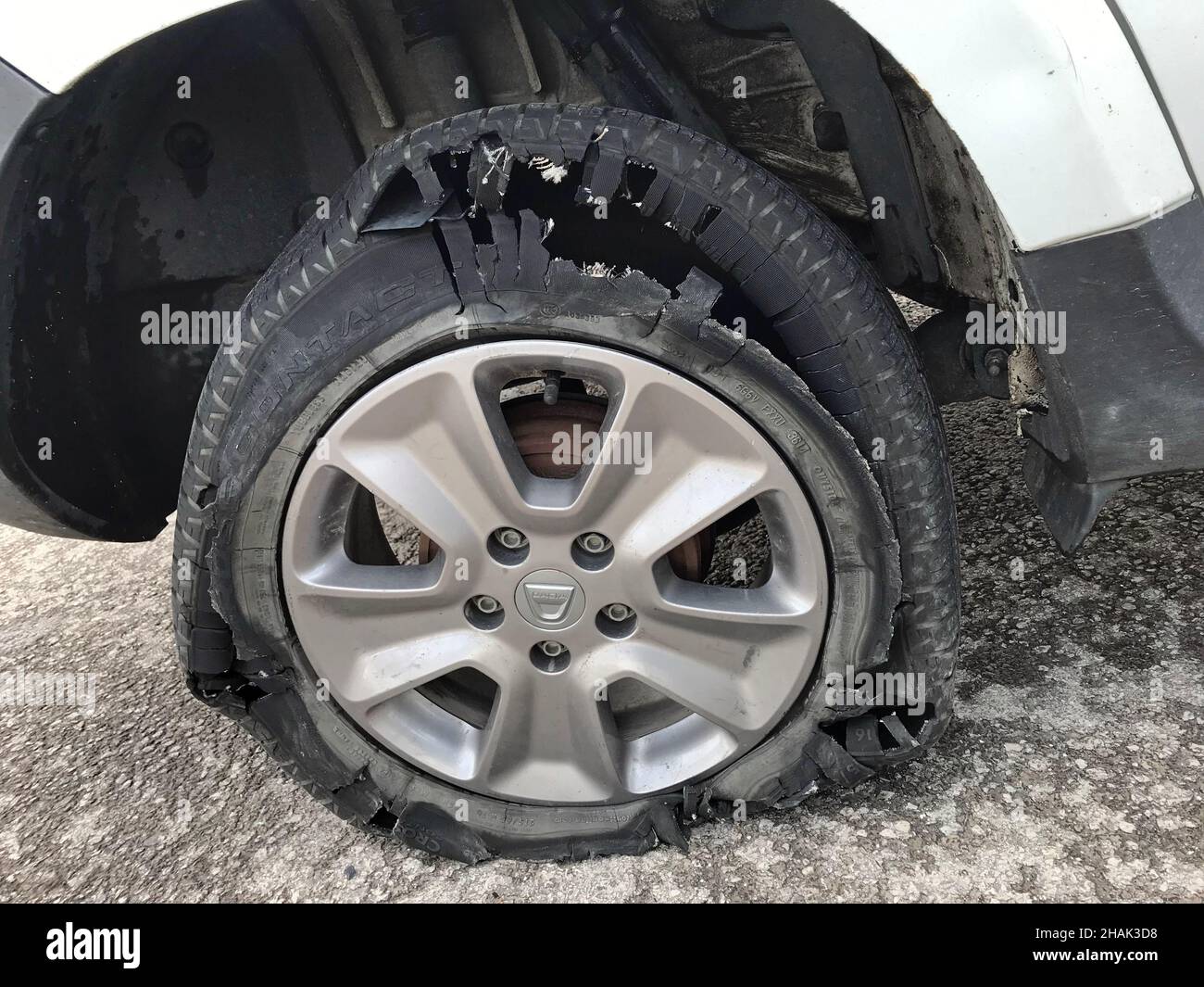 Broken and shredded tire of automobile at roadside Stock Photo Alamy