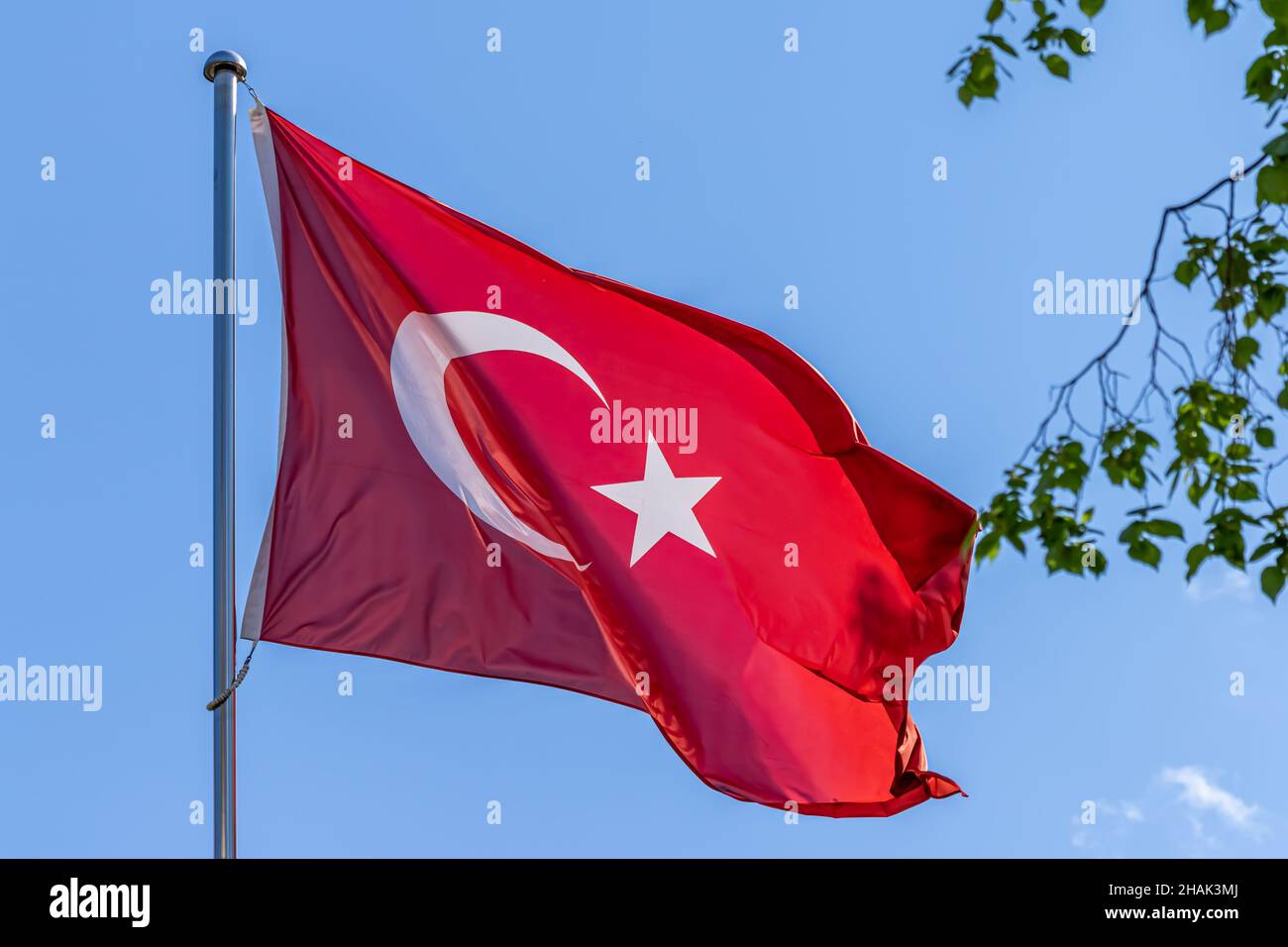 Turkish national flag waving on blue sky background. Republic of Turkey, TR Stock Photo