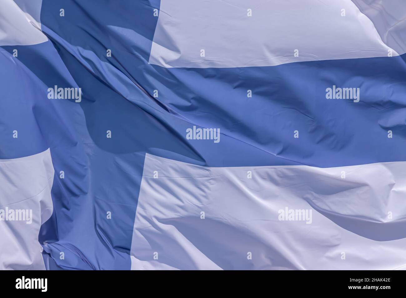 Part of Finnish national flag waving, close-up. Republic of Finland, FIN Stock Photo