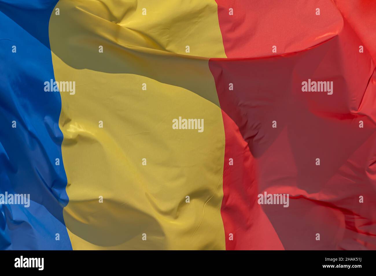 Part of Romanian national flag waving, close-up. Romania, RO Stock Photo