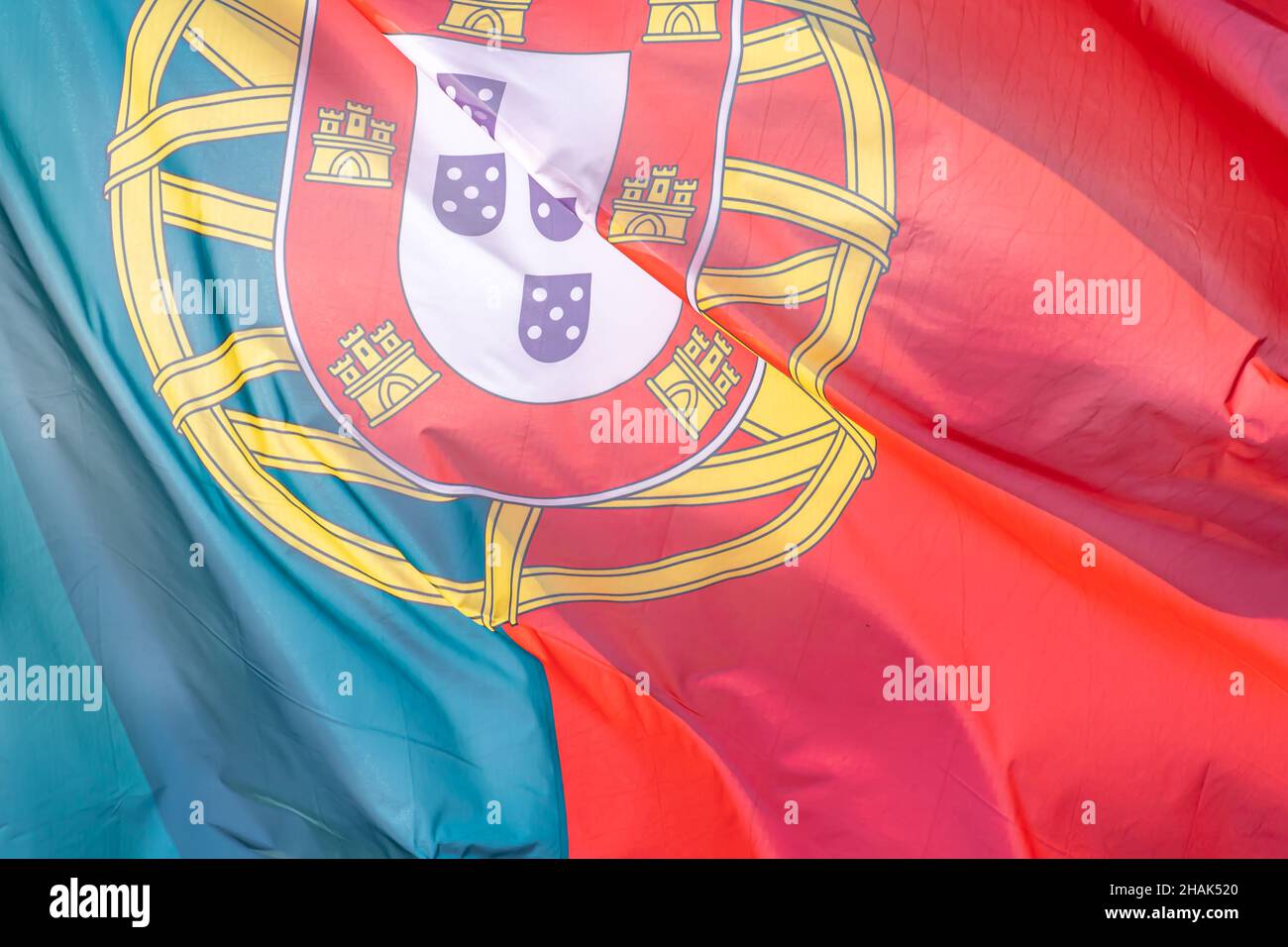 Part of Portuguese national flag waving, close-up. Portuguese Republic, PT Stock Photo