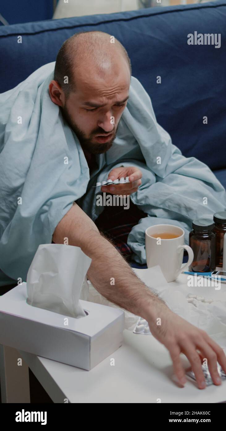Unwell Man Unwell man searching capsule tablets hi-res stock photography and ...