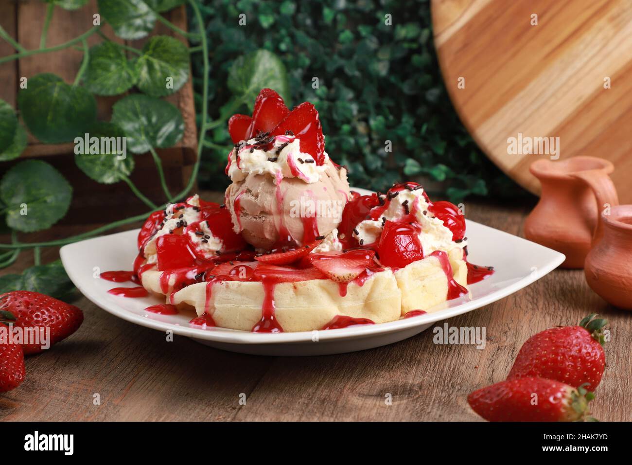 Waffle with ice cream cherries and strawberries Stock Photo - Alamy