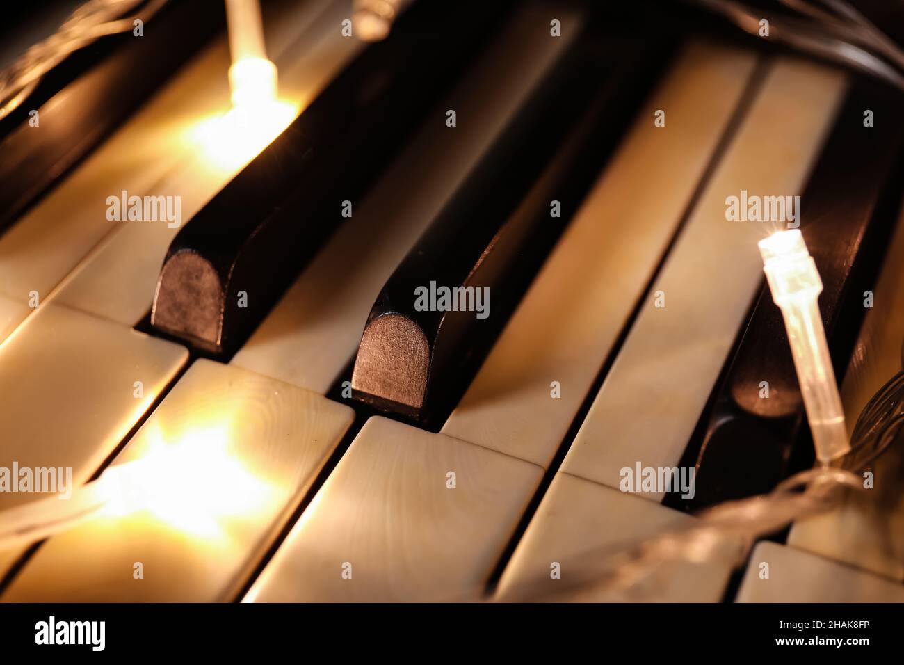 Piano keys with glowing lights, closeup Stock Photo