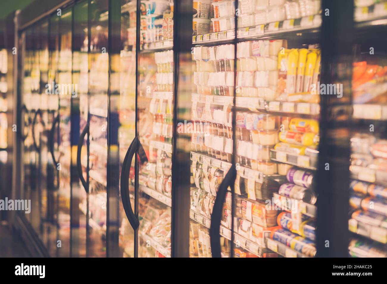 Chicago, IL- August 21, 2021: Refrigerators  and glass door with many different food products in grocery store  editorial use only Stock Photo