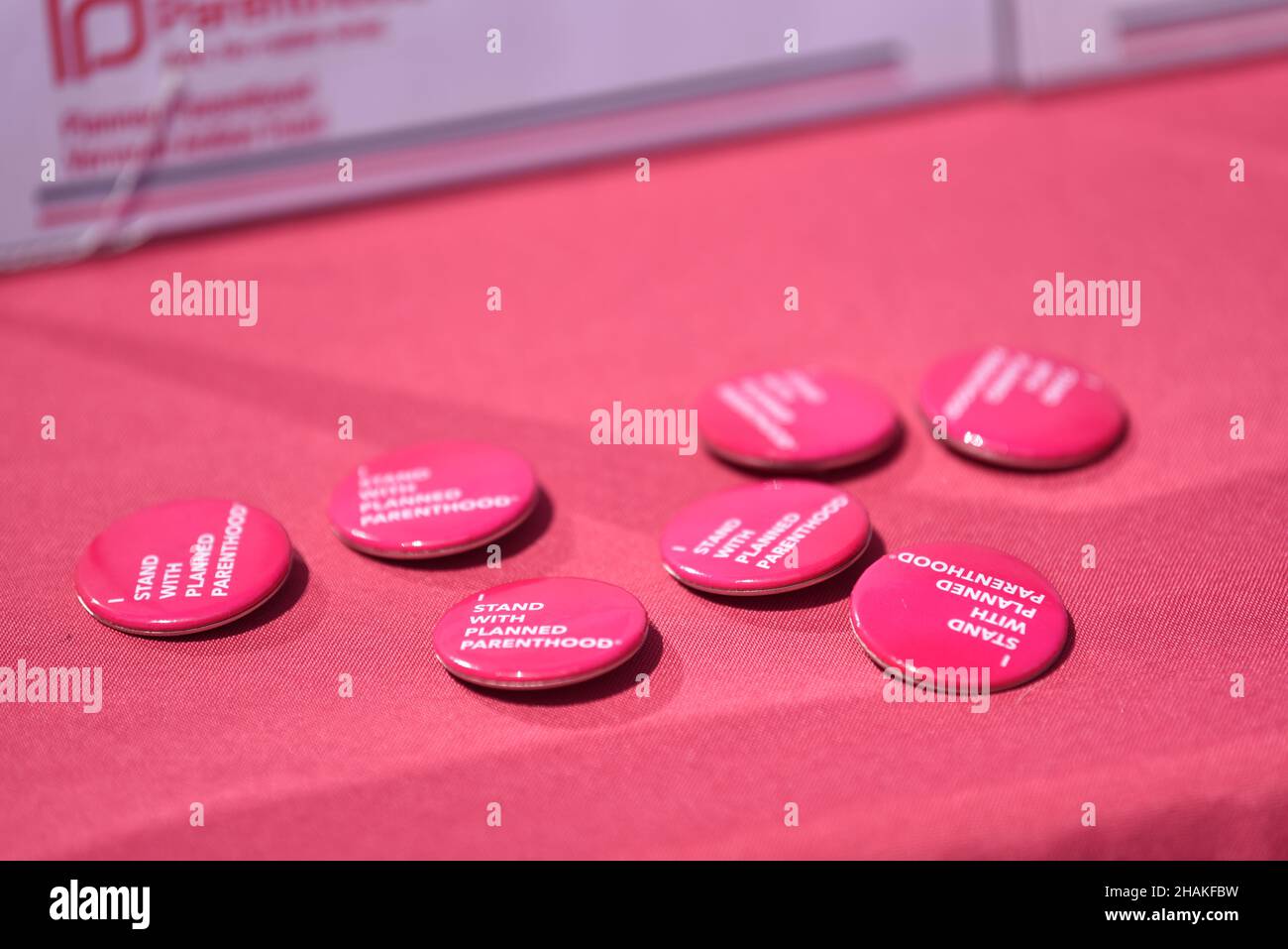 Planned Parenthood buttons lie on a table during a labor rally on May 1 in the state of Vermont, USA. Stock Photo
