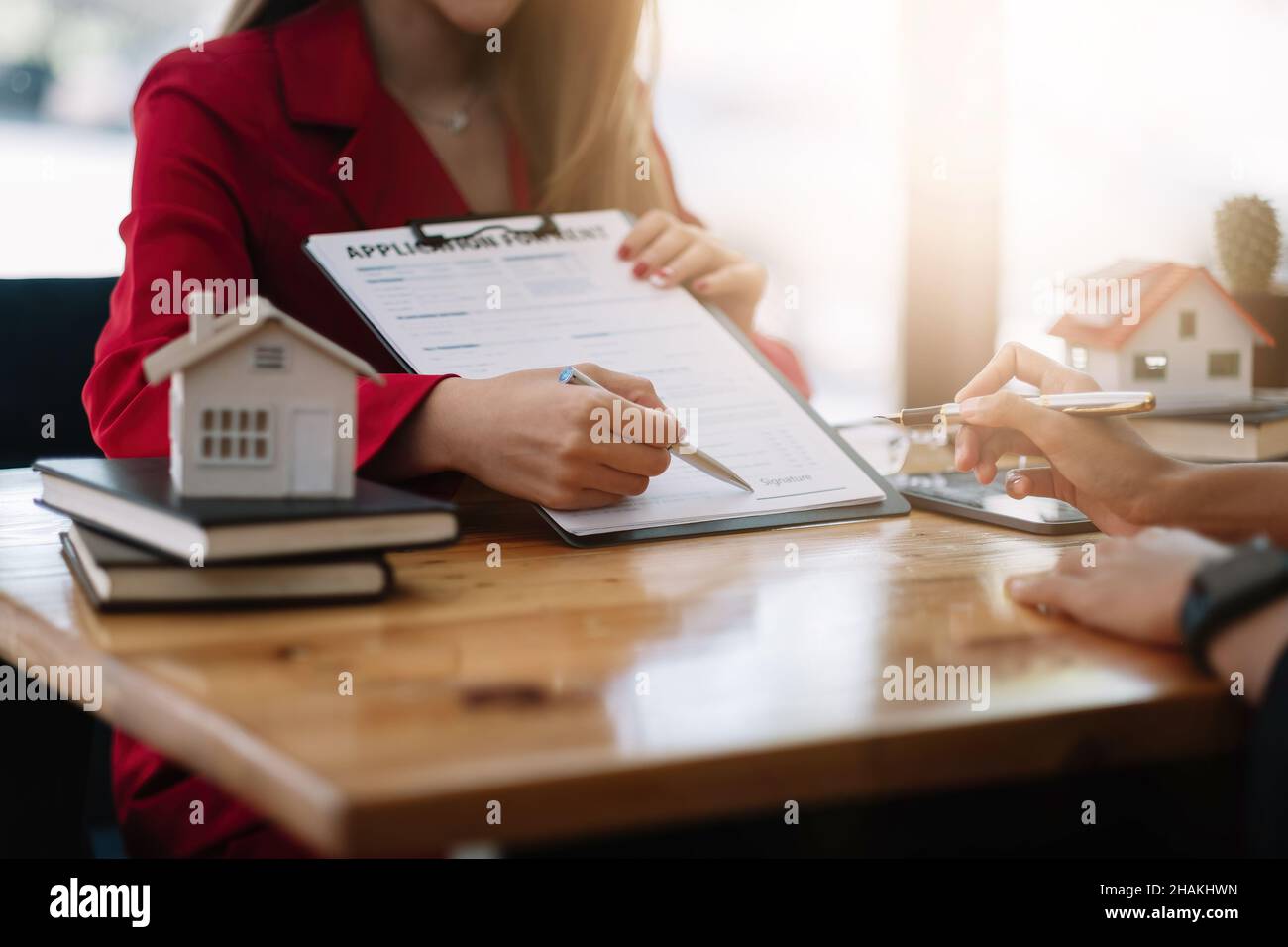 Client sign the documents to make the contract legally, Home sales and home rental real estate concept Stock Photo