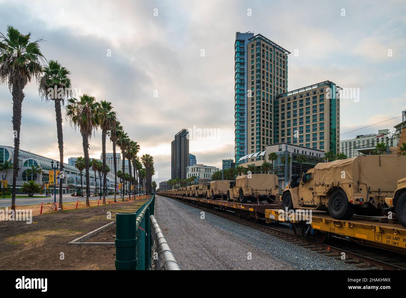 Military vehicles are transported on a train.  Stock Photo