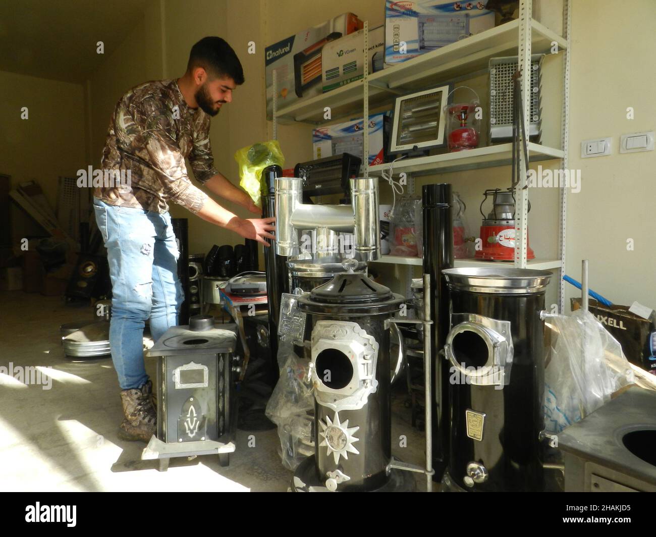 Beirut, Lebanon. 13th Dec, 2021. A man displays several models of