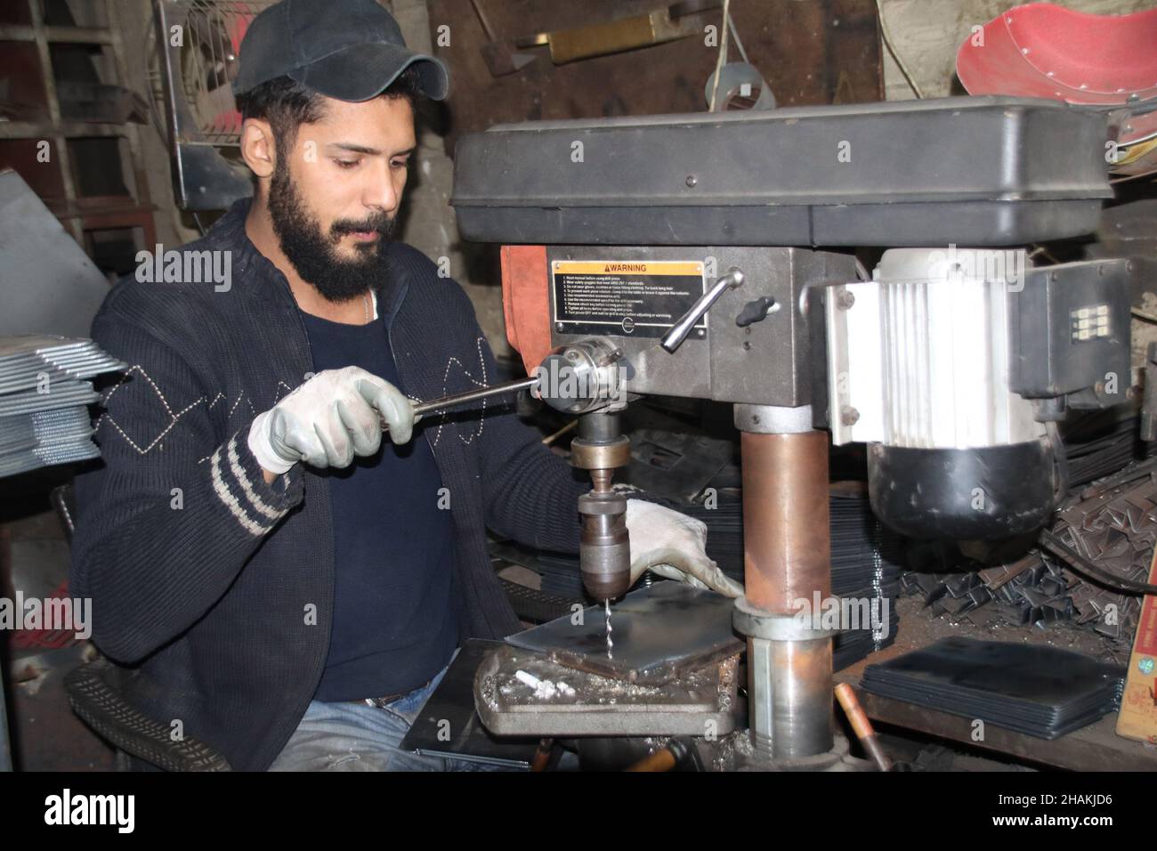 Beirut, Lebanon. 10th Dec, 2021. A worker operates on wood and diesel