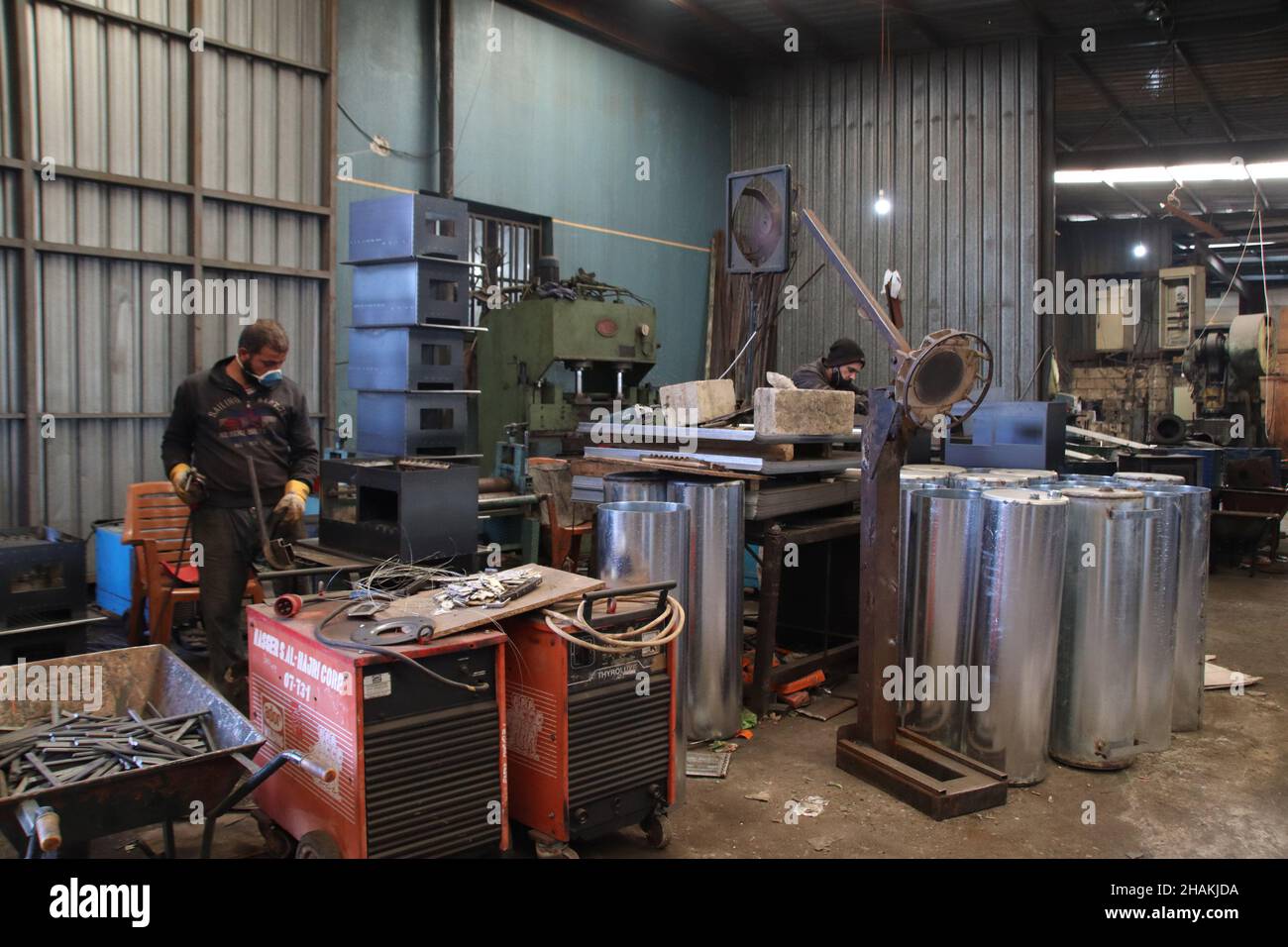 Beirut, Lebanon. 10th Dec, 2021. Workers make heaters in a factory in