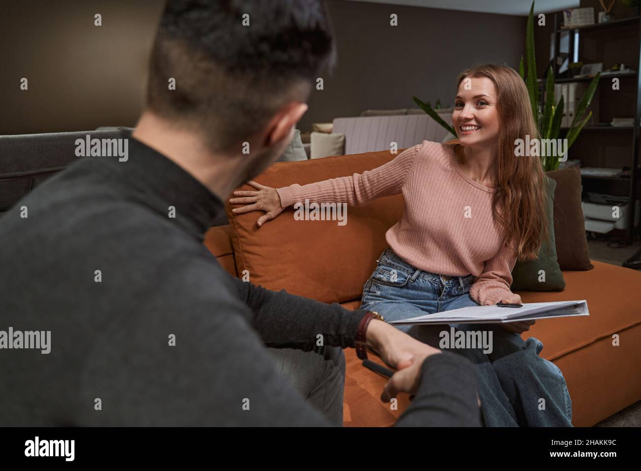 Two furniture store customers buying new couch Stock Photo Alamy