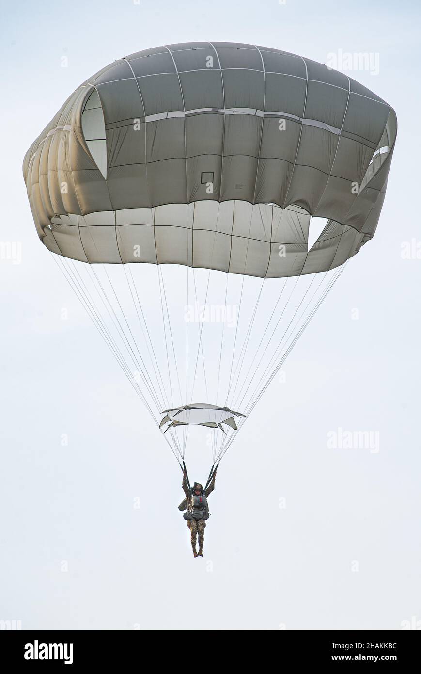A U.S. Army paratrooper assigned to the 173rd Airborne Brigade prepares to land on Juliet Drop Zone during a joint airborne operation between the U.S. Air Force, Marine Corps, U.S. and Italian Army paratroopers on Dec. 10, 2021.    The 173rd Airborne Brigade is the U.S. Army's Contingency Response Force in Europe, providing rapidly deployable forces to the United States European, African, and Central Command areas of responsibility. Forward deployed across Italy and Germany, the brigade routinely trains alongside NATO allies and partners to build partnerships and strengthen the alliance.    (U Stock Photo