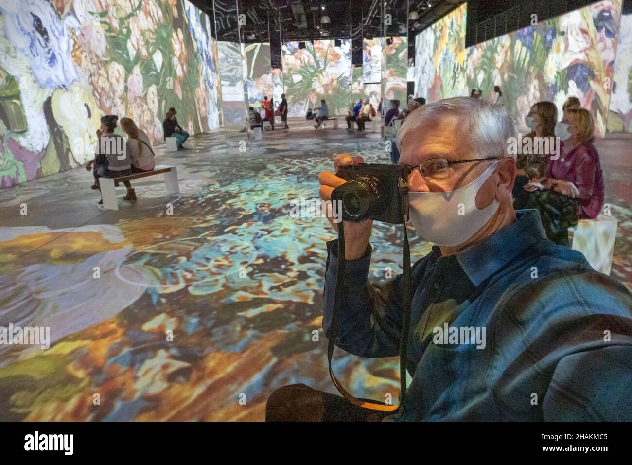 Photographer at the Immersive Van Gogh Exhibit, Arizona. Stock Photo