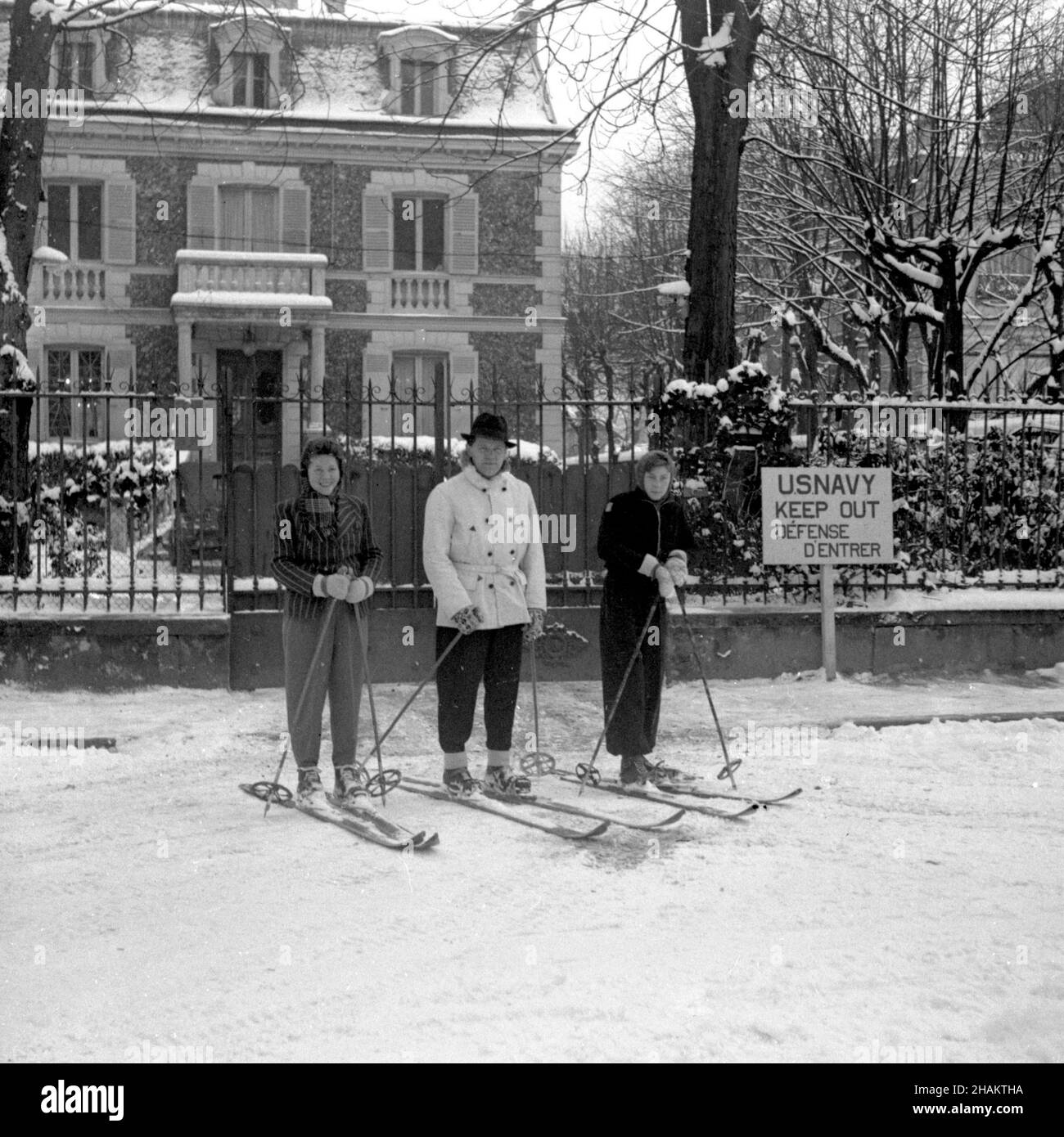 Parisian skiers in front of US Navy intelligence station in Nogent-sur-Marne.  Three local cross-country skiers pause on a snowy day in front of 55 Avenue  de la Belle Gabrielle. November 1944 to