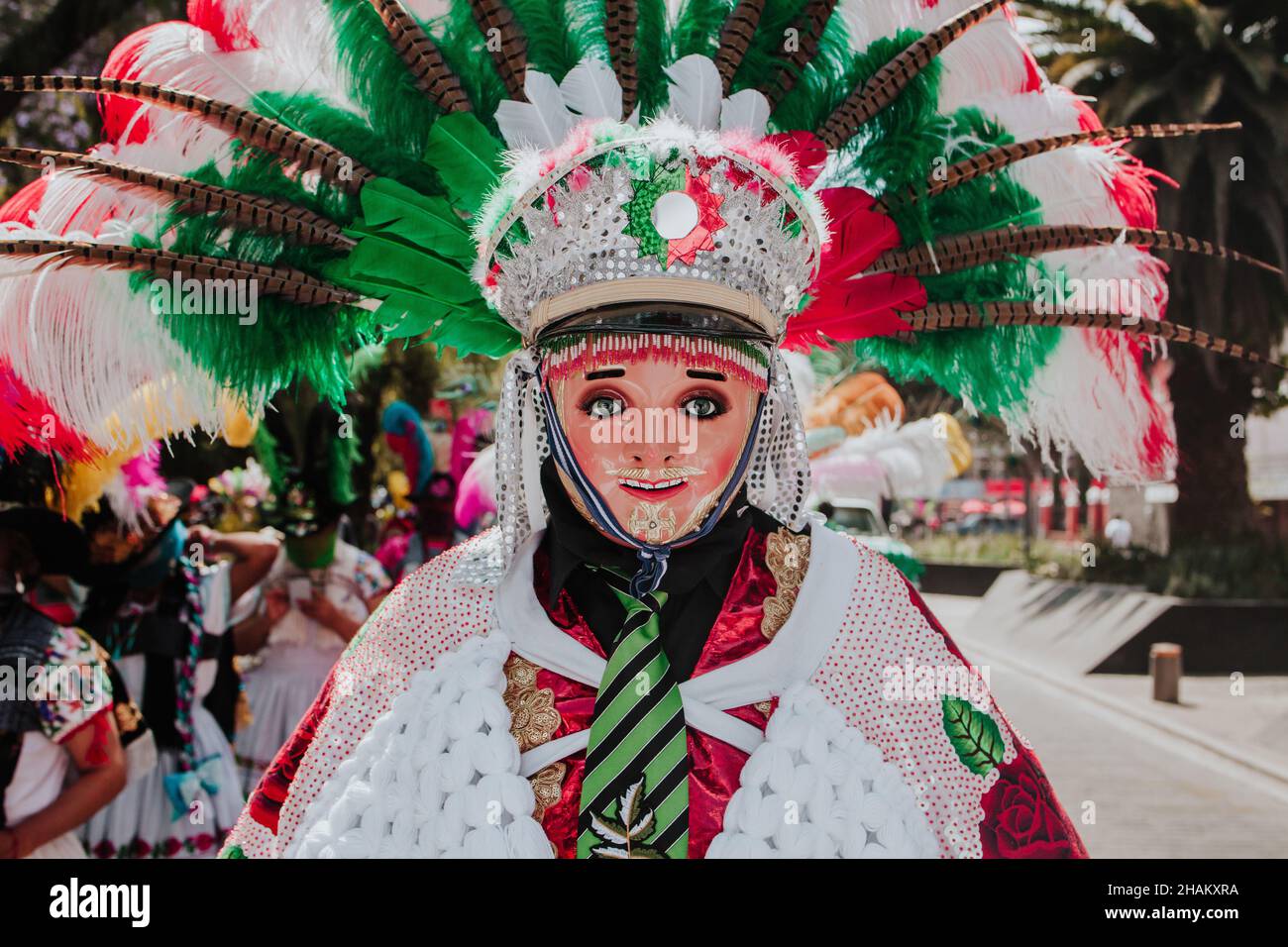 Huehues Mexico, mexican Carnival dancer wearing a traditional folk costume and mask in Latin America Stock Photo