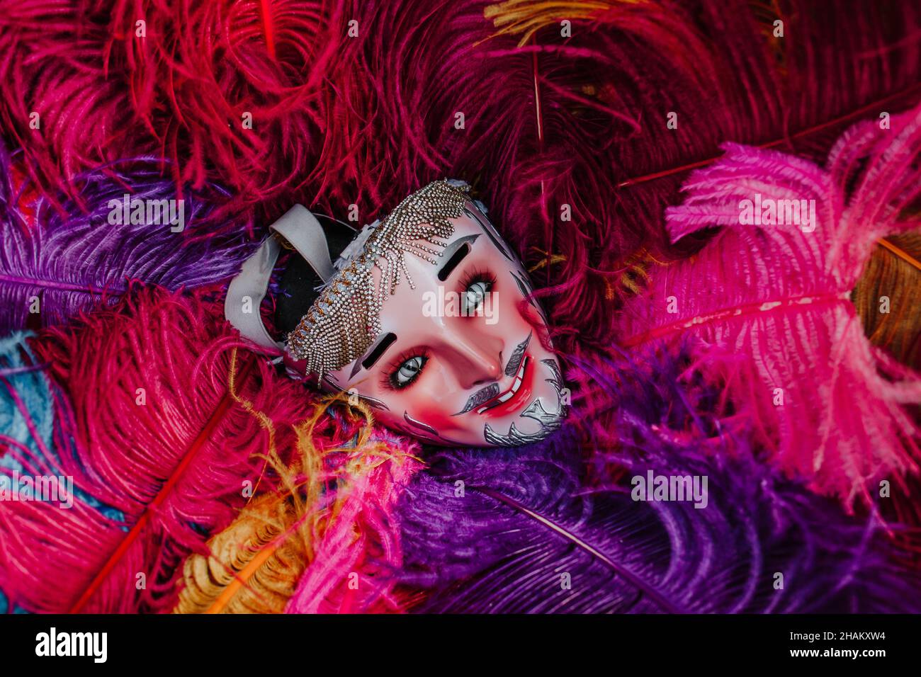Mexican Carnival mask for traditional parade on colorful bird feathers in Mexico Latin America Stock Photo