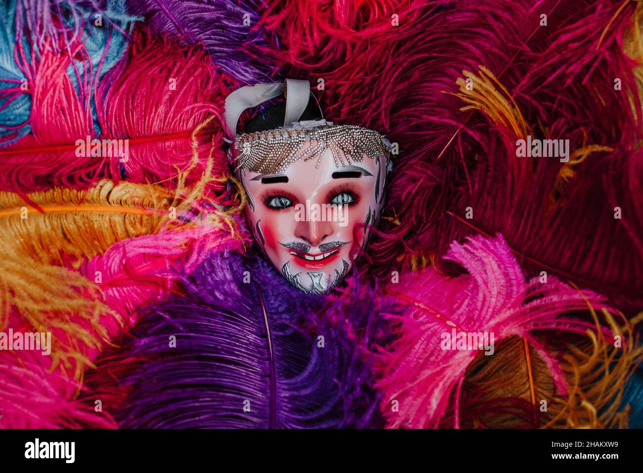 Mexican Carnival mask for traditional parade on colorful bird feathers in Mexico Latin America Stock Photo