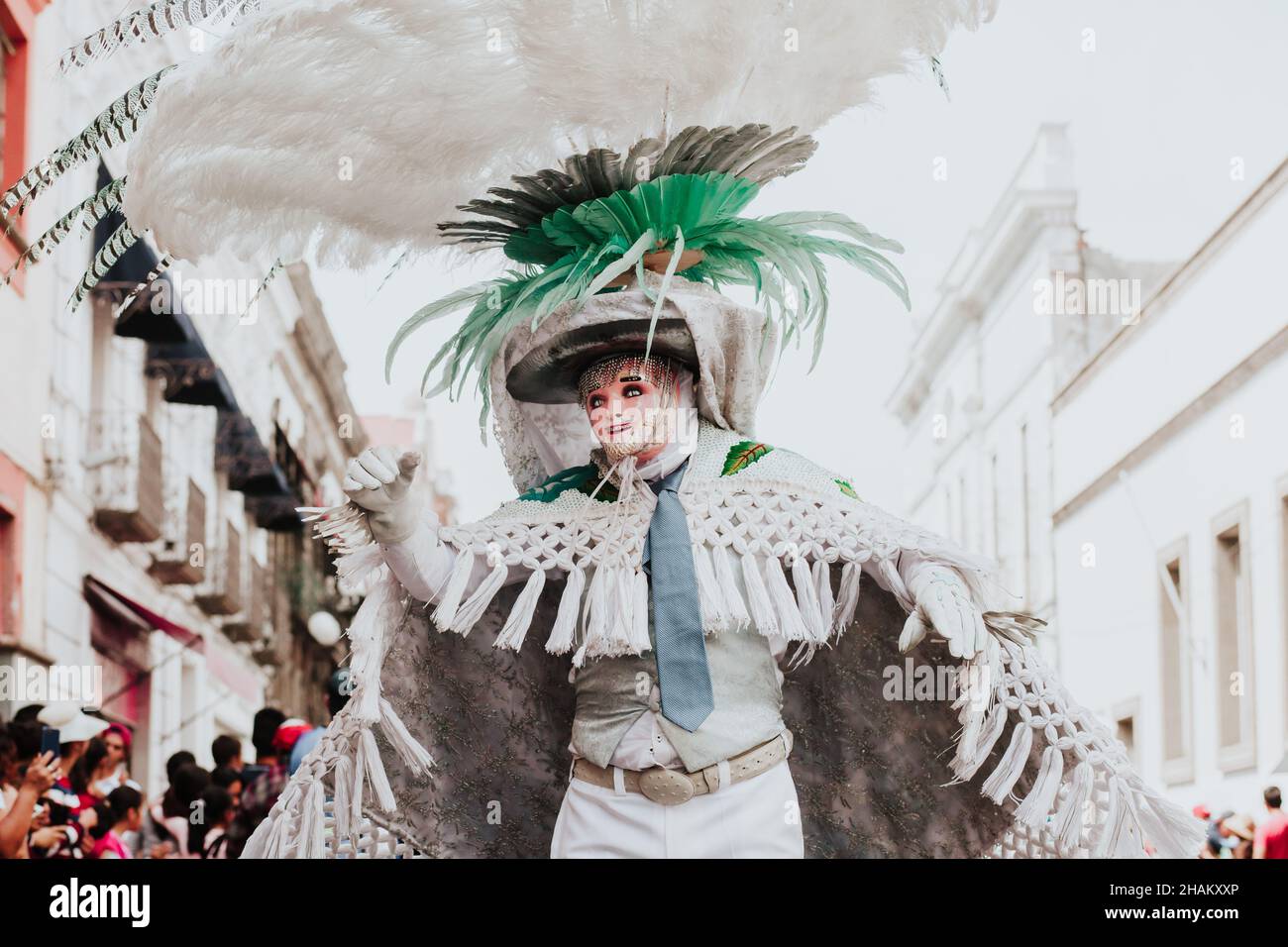 Huehues Mexico, mexican Carnival dancer wearing a traditional folk costume and mask in Latin America Stock Photo