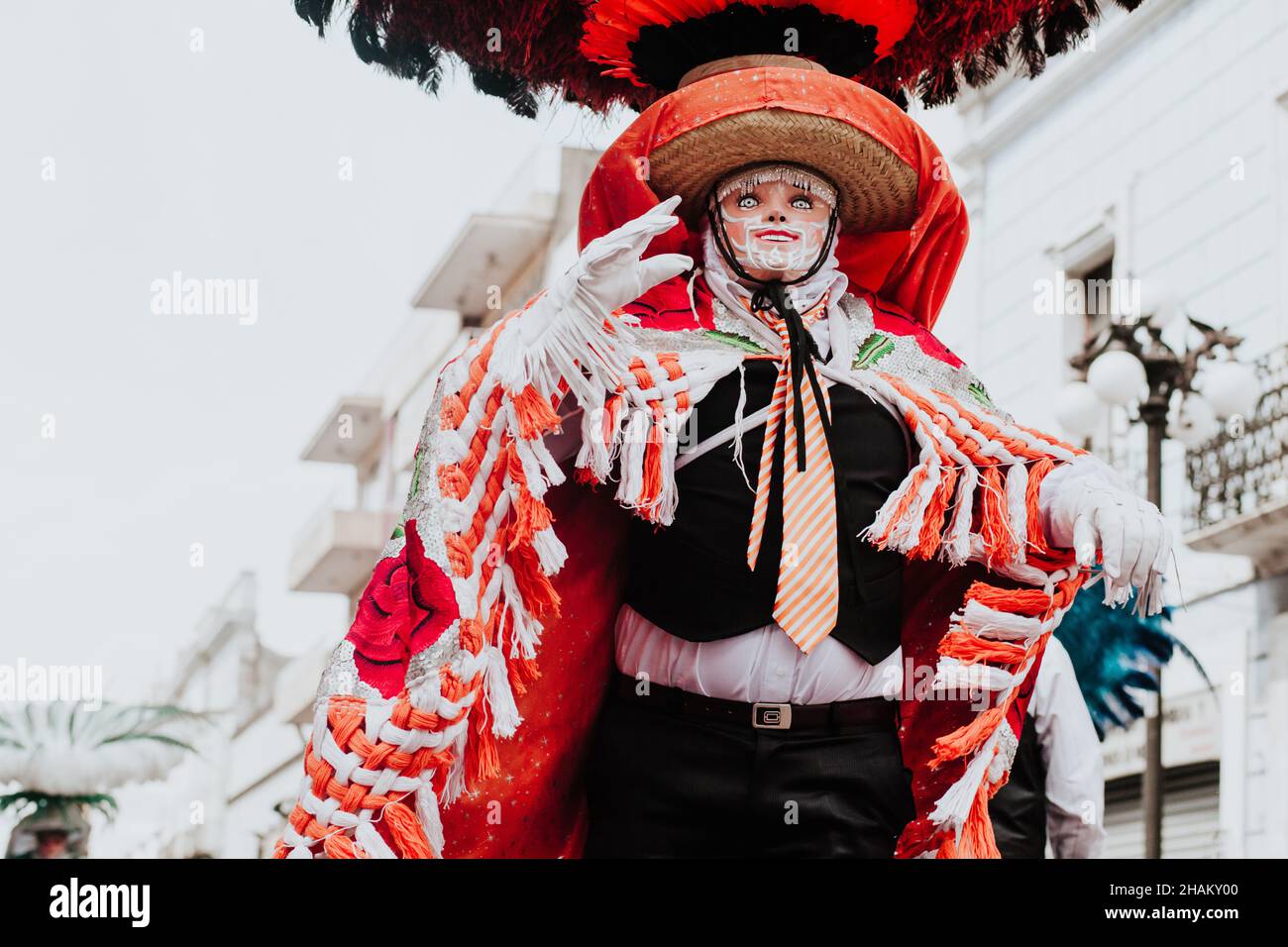 Huehues Mexico, mexican Carnival dancer wearing a traditional folk costume and mask in Latin America Stock Photo