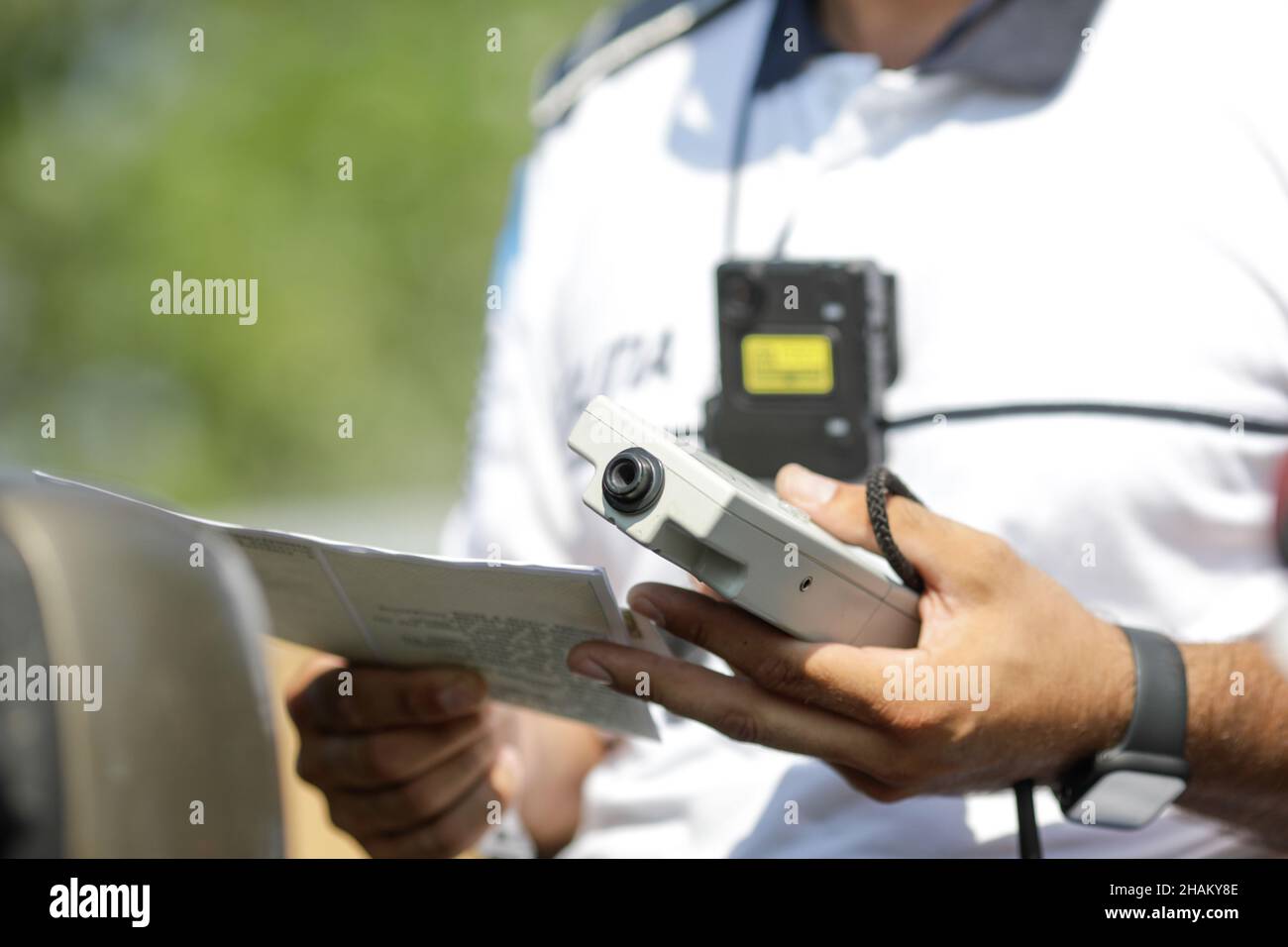 Highway 2 Bucharest - Constanta, Romania - 10 August, 2021: Romanian Road Police officer hands a breathalyser to a driver to test his alcohol level. Stock Photo