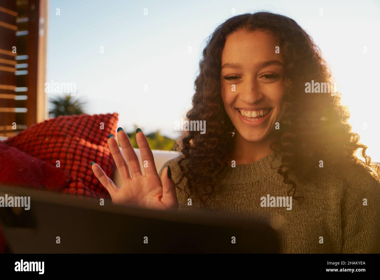 African American female waving at digital tablet while on video call ...