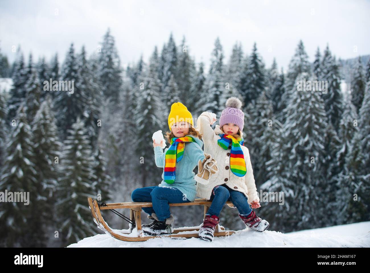 Fun In Snow Kids play snowball, snow ball fight for children. Children son and ...