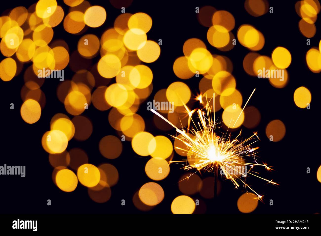 burning sparkler or bengal light on bokeh background Stock Photo