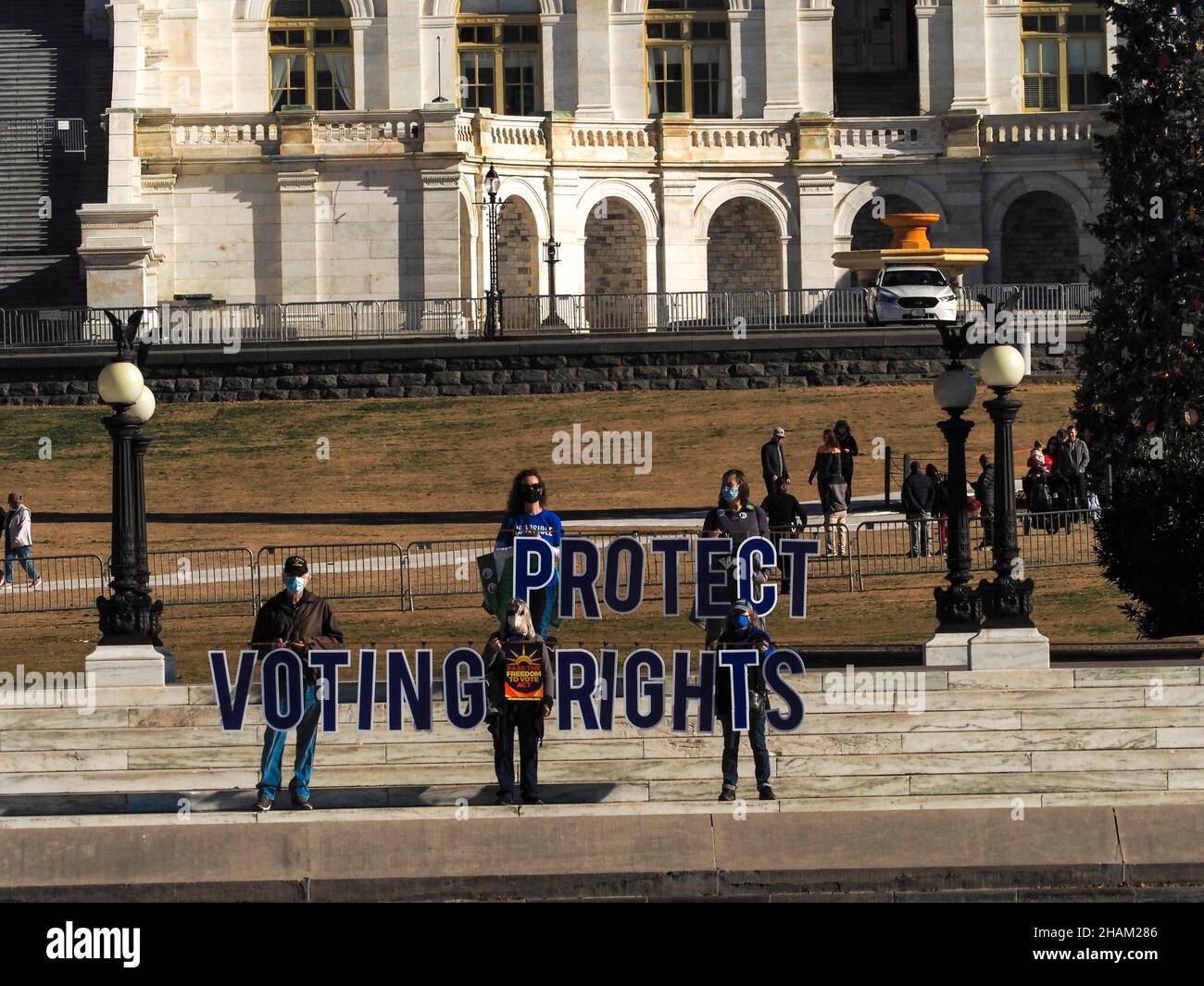 December 13, 2021, Washington, District of Columbia, USA: Participants in the Poor PeopleÃs Campaign hold letters reading 'Protect Voting Rights' in front of the US Capitol. This refers to the call for Congress to pass stalled voting rights legislation before the end of 2021. (Credit Image: © Sue Dorfman/ZUMA Press Wire) Stock Photo
