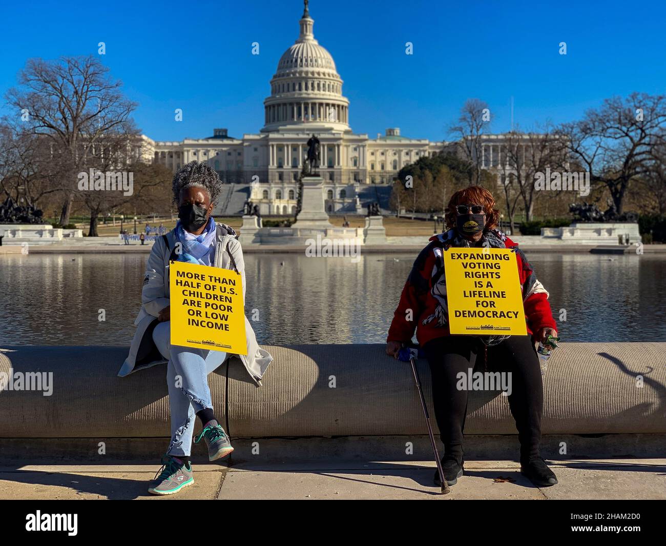 December 13, 2021, Washington, District of Columbia, USA: Sharon Malloy came from the DC and Pamela Malloy came from Michigan to attend the Poor PeopleÃs Campaign 'Get it Done in Ã21' rally at the US Capitol. Participants came from 33 states to demand Congress pass voting rights protections and the Build Back Better plan before the end of the year. (Credit Image: © Sue Dorfman/ZUMA Press Wire) Stock Photo