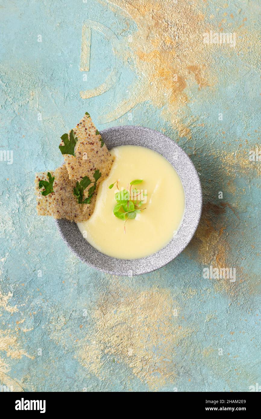 Potato cauliflower soup puree with croutons, top view. Vegetarian healthy food concept Stock Photo