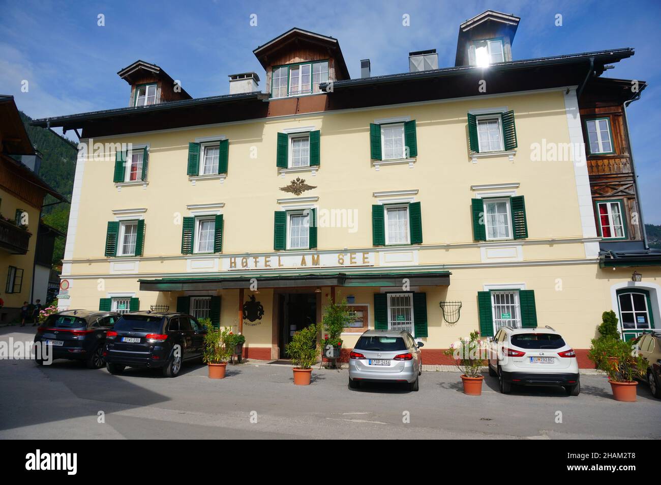 AULTAUSSEE, AUSTRIA - Nov 07, 2021: The parked cars in front of the Hotel Am See. Aultaussee, Austria Stock Photo