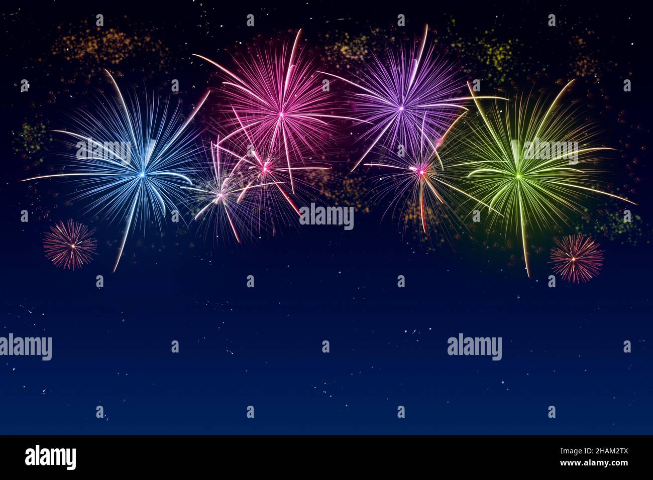 Colorful fireworks celebration and the twilight sky background with copyspace at the bottom of image. Stock Photo